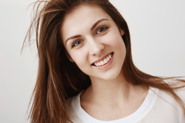 close-up-beautiful-young-woman-looking-happy-smiling-with-white-teeth_176420-20867